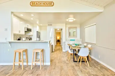 a kitchen and dining room with a table and chairs at Perfect 3 Bedroom Home between the Bay and Beach in Newport Beach