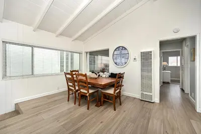 a dining room with a table and chairs at Oceanfront Home with UNOBSTRUCTED VIEW in Newport Beach