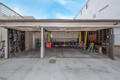 an open garage with a bunch of bikes in it at Oceanfront Home with UNOBSTRUCTED VIEW in Newport Beach