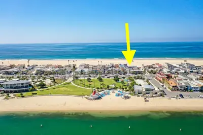 an aerial view of a beach with a yellow arrow at Beachfront Getaway on the Sand in Newport Beach