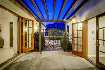 an entrance to a house with a blue ceiling at Mediterranean Beauty with Rooftop Deck and Views in San Diego