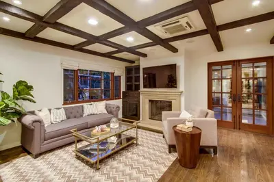 a living room with a couch and a fireplace at Mediterranean Beauty with Rooftop Deck and Views in San Diego