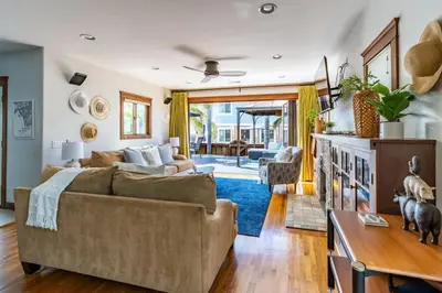 a living room with a couch and a table at Mission Beach Retreat Steps to Bay & Beach in San Diego