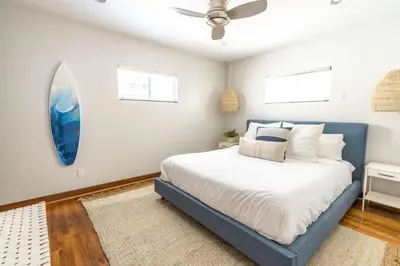 a bedroom with a bed and a ceiling fan at Mission Beach Retreat Steps to Bay & Beach in San Diego