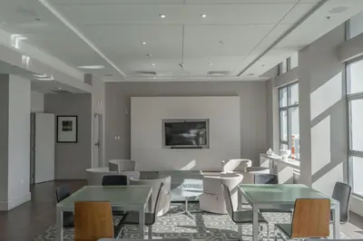 a room with tables and chairs in a building at Skyline Escape in the Heart of Downtown in San Diego