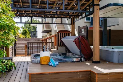 a bunch of luggage sitting on a deck at Surfside Charmer One Block to Beach in San Diego