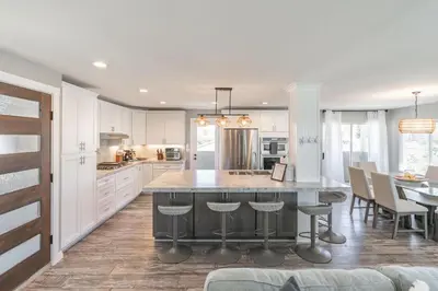 a kitchen with a large island in the middle at Surfside Charmer One Block to Beach in San Diego