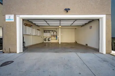 an empty garage with an open door in a building at Newport Paradise - Oceanfront Home by the Pier in Newport Beach