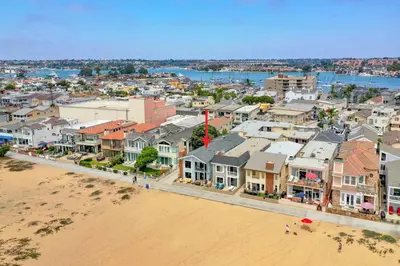 an aerial view of a city with a beach and buildings at 3 Bedroom Home in Balboa - Walk to Pier & Restaurants in Newport Beach