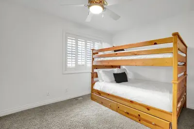 a bedroom with a bunk bed and a window at Fantastic bayside vacation home - WiFi, central AC, patio, private washer & dryer in San Diego