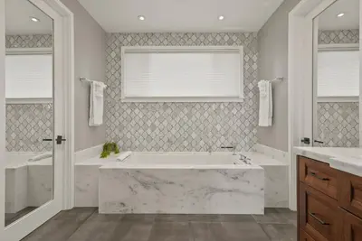 a bathroom with a large tub and two sinks at Luxury Bird Rock Home with Private Pool, Hot Tub & Fire Pit! in San Diego