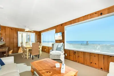 a living room with a view of the ocean at Upstairs 2 Bedroom Home with Ocean Views on 65th St in Newport Beach