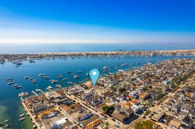 an aerial view of a harbor with boats in the water at Balboa Island Luxury Penthouse Suite With Bay Views in Newport Beach