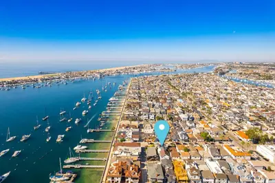 an aerial view of a harbor with boats at Balboa Island Luxury Penthouse Suite With Bay Views in Newport Beach