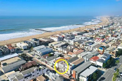 an aerial view of a city and the beach at 4 Bedroom Home with Rooftop & Peek-A-Boo Ocean View in Newport Beach