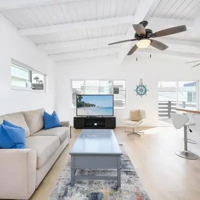 2 Bedroom Upstairs with Balcony Steps from the Sand