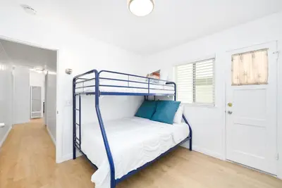 a bedroom with a bunk bed in a room at Renovated 3 Bedroom Home on 41st-1 min walk to Beach in Newport Beach