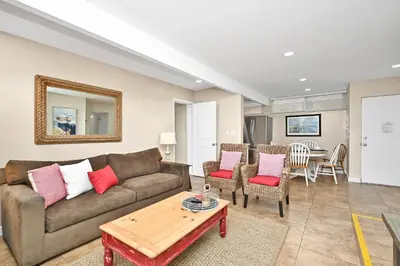 a living room with a couch and a table at 5 Bedroom 4 Bath Duplex with Parking on 46th St! in Newport Beach