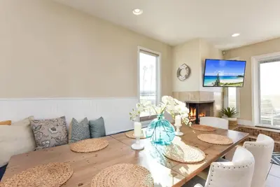 a dining room with a wooden table and chairs at 7 Bedroom Oceanfront Home & Back House in Newport Beach