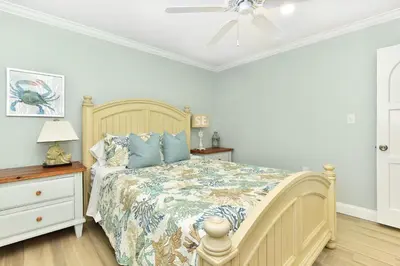 a bedroom with a bed and a ceiling fan at 2 Bedroom BACK Apt at OCEANFRONT HOME on 15th St in Newport Beach