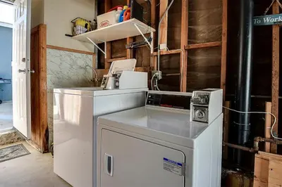 a kitchen with a sink and a dishwasher at Oceanfront Back Home with View of the Sea in Newport Beach