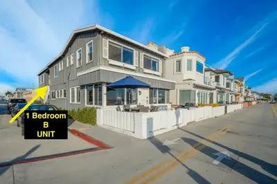 a house with a sign that says i bedroom b unit at 1 Bedroom Apartment in the back of our Oceanfront Home in Newport Beach