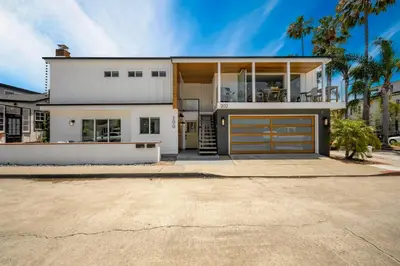 a large white house with a garage at 4 bedroom Renovated Home on Balboa Island in Newport Beach
