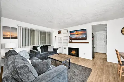 a living room with a couch and a fireplace at Charming 1-Bedroom Home on 29th Street in Newport Beach