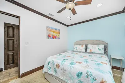 a bedroom with a bed and a ceiling fan at 3 Bedroom Luxury Home Steps to Balboa Fun Zone in Newport Beach