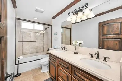 a bathroom with a sink and a toilet at 3 Bedroom Luxury Home Steps to Balboa Fun Zone in Newport Beach