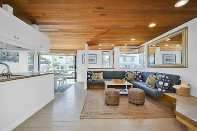 a kitchen and living room with a couch and a table at 4 bedroom Home in Quiet Neighborhood near Beach in Newport Beach