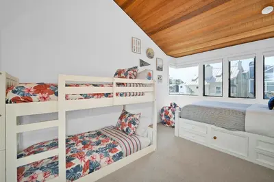 a bedroom with two bunk beds and a window at 4 bedroom Home in Quiet Neighborhood near Beach in Newport Beach