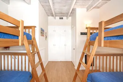 a room with two bunk beds and a hallway at Single Family Home on the Ocean with BEAUTIFUL VIEWS in Newport Beach