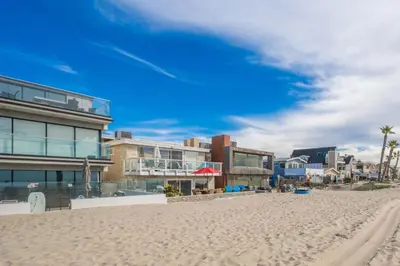 a view of the beach with buildings and condos at Single Family Home on the Ocean with BEAUTIFUL VIEWS in Newport Beach