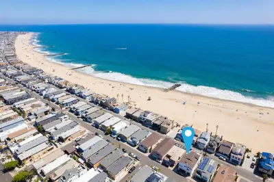 an aerial view of a beach with houses and the ocean at Upscale Home with Rooftop Deck, Jacuzzi, & Firepit in Newport Beach