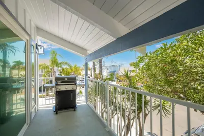 a balcony with a grill on a building at Brand New Modern Home by the Beach with Patio & BBQ in Newport Beach