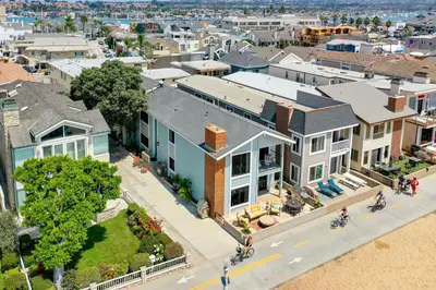 an aerial view of a city with houses at 7 Bedroom Oceanfront Triplex Building in Newport Beach