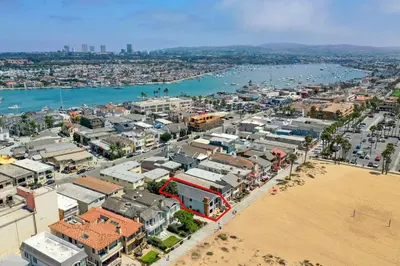 an aerial view of a city next to a beach at 2 Bed 2 Bath BACK APT Steps to the Sand in Newport Beach