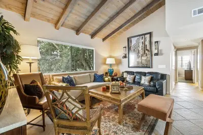a living room with a couch and a table at 2 Bed 2 Bath BACK APT Steps to the Sand in Newport Beach