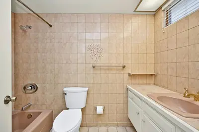 a bathroom with a toilet and a sink at Beachfront home with Sweeping Ocean Views, AC, Walk to the Pier, Restaurants, Shops, Activities in Newport Beach