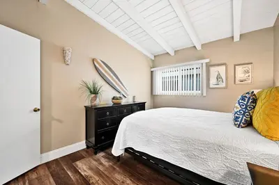 a bedroom with a bed and a window at Stunning Oceanfront Retreat in Newport Beach in Newport Beach