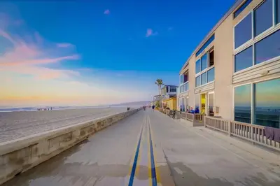 a building on the beach next to the ocean at Ocean View Blue Mission Beach Paradise in San Diego