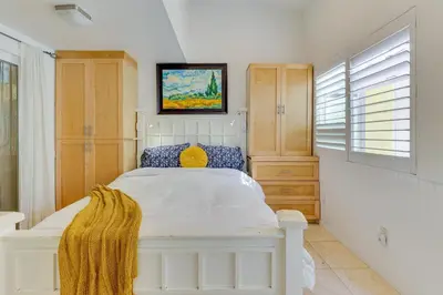 a bedroom with a white bed in a room at Carlsbad Bungalow Patio, Hot Tub, Close to Beach! in Carlsbad