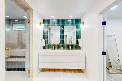 a bathroom with a white sink and two mirrors at Dog-Friendly Home Saltwater Pool, Fire Pit, Games in San Diego