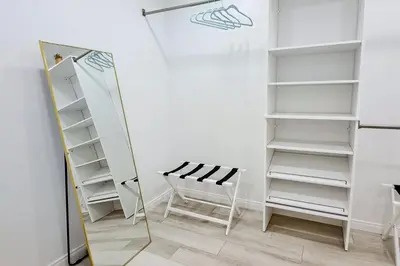 a dressing room with a mirror and a chair at Dog-Friendly Home Saltwater Pool, Fire Pit, Games in San Diego