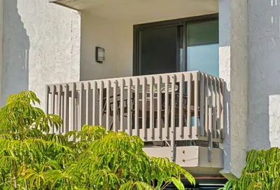 a wooden railing on a balcony of a house at North Coast C106 in Oceanside