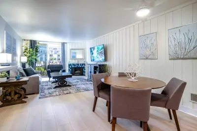 a living room with a table and a couch at North Coast C106 in Oceanside