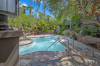 a small swimming pool in a yard with trees at North Coast C106 in Oceanside