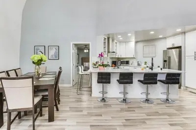 a kitchen and dining room with a table and chairs at North San Diego Retreat with Deck, Fire Pit Table! in Escondido