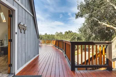 a wooden deck with a door on a house at North San Diego Retreat with Deck, Fire Pit Table! in Escondido